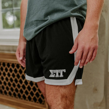 Sig Tau Greek Fraternity Black 7" Mesh Shorts with Greek letters.