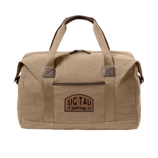 Fraternity Tan Canvas Duffel Bag with leather patch on front.